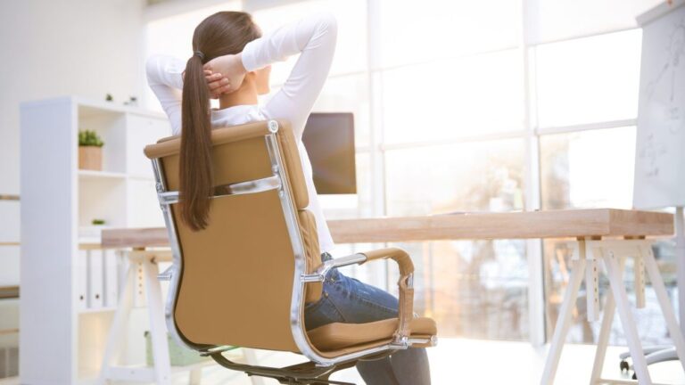 woman leaning back in chair