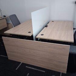 Height adjustable benching desks a